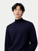 Timeless Mock Neck Cashmere Sweater Navy Blazer worn by model, detail view, on white background