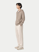 Men's Zip-Up Cashmere Hoodie Taupe worn by model, side view on white background