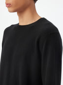 Men's Black Crewneck Cashmere Sweater worn by model, detail view on white background