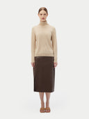 Women's Beige Cashmere Basic Turtle Neck Sweater worn by model, front view on white background