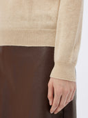 Women's Beige Cashmere Basic Turtle Neck Sweater worn by model, detail view on white background