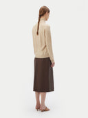 Women's Beige Cashmere Basic Turtle Neck Sweater worn by model, back view on white background