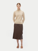 Women's Beige Cashmere Basic Turtle Neck Sweater worn by model, front view on white background