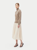 Women's Taupe Cashmere Basic Turtle Neck Sweater worn by model, side view on white background