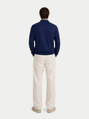 Men's Navy Cashmere Polo Sweater worn by model, back view on white background