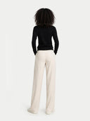 Women's Black Cashmere Crewneck Sweater worn by model, back view on white background