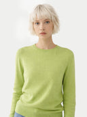 Person wearing a light green sweater on a white background. #color_jade-green