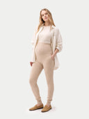 Over Bump Maternity Beige Cashmere Knit Pants worn by model detail view on white backround