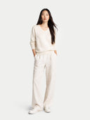 Women's White Cashmere Essential V-Neck Sweater worn by model, front view on white background