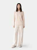 Women's Ivory White Cashmere Crewneck Sweater worn by model, front view on white background 