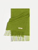 Flat lay of the Cashmere Fringed Scarf in Green, folded, with the GOBI label and fringed ends