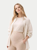 Over Bump Maternity Beige Cashmere Knit Pants worn by model detail view on white backround