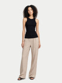 A black ribbed knit sleeveless tank top with a crew neck, displayed flat against a light gray background. #color_black