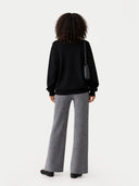Women's Grey Cashmere Pants worn by model, back view on white background
