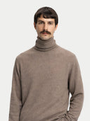 Men's Taupe Turtleneck Cashmere Sweater worn by model, detail view on white background