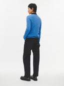 Blue cashmere cardigan on a light gray background. #color_blue