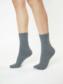 Unisex Cashmere Trim Knit Bed Socks Dim Gray worn by model, detail view on white background