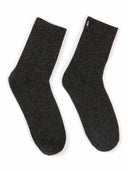 Set of black blanket, eye mask, and socks on a white background #color_charcoal