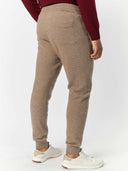 Men's Cashmere Jogger Taupe worn by model, back view on white background