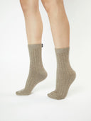 Unisex Cashmere Trim Knit Bed Socks Taupe worn by model, detail view on white background