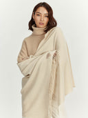 Women's Cashmere Woven Scarf Beige worn by model, detail view on white background