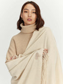 Women's Cashmere Woven Scarf Beige worn by model, detail view on white background