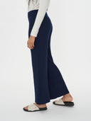 Navy blue ribbed knit scarf on a white background #color_navy