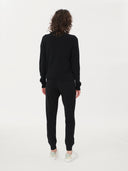 Women's Black Cashmere Full-Zip Cardigan worn by model, back view on white background