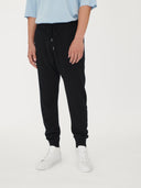 Men's Cashmere Jogger Black worn by model, detail view on white background