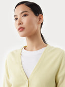 Women's  Tender Yellow Cashmere V-Neck Sweater worn by model, detail view on white background  