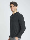 Men's Charcoal Cashmere Polo Sweater worn by model, side view on white background