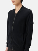 Black zip-up cashmere hoodie on a light gray background #color_black