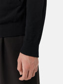 Black zip-up cashmere hoodie on a light gray background #color_black