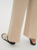 Women's Cashmere Pants Beige worn by model, detail view on white background
